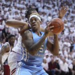 
              CORRECTS CITY TO BLOOMINGTON, INSTEAD OF INDIANAPOLIS - North Carolina forward Armando Bacot (5) drives to the basket past Indiana forward Malik Reneau, left, during the first half of an NCAA college basketball game in Bloomington, Ind., Wednesday, Nov. 30, 2022. (AP Photo/Darron Cummings)
            