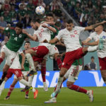 
              Poland's Grzegorz Krychowiak (10) and Mexico's Edson Alvarez go for a header during a World Cup group C soccer match at the Stadium 974 in Doha, Qatar, Tuesday, Nov. 22, 2022. (AP Photo/Martin Meissner)
            