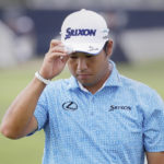 Hideki Matsuyama tips his cap to the gallery as they cheer after he sank his putt on the 17th green during the second round of the Houston Open golf tournament Friday, Nov. 11, 2022, in Houston. (AP Photo/Michael Wyke)