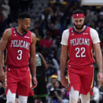New Orleans Pelicans guard CJ McCollum (3) and forward Larry Nance Jr. (22) walk down the court after a foul late in the second half of an NBA basketball game against the Boston Celtics in New Orleans, Friday, Nov. 18, 2022. The Celtics won 117-109. (AP Photo/Gerald Herbert)