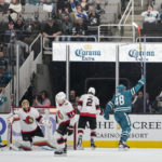 The San Jose Sharks celebrate after a goal by center Logan Couture, left, during the second period of an NHL hockey game against the Ottawa Senators in San Jose, Calif., Monday, Nov. 21, 2022. (AP Photo/Godofredo A. Vásquez)