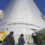 
              A building which houses the headquarters of major advertising company Dentsu is pictured in Tokyo Friday, Nov. 25, 2022. Japanese prosecutors raided the headquarters of Dentsu Friday, as the investigation into corruption related to the Tokyo Olympics widened. (Kyodo News via AP)
            