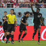 
              Canada's Alphonso Davies, right, celebrates after scoring the opening goal during the World Cup group F soccer match between Croatia and Canada, at the Khalifa International Stadium in Doha, Qatar, Sunday, Nov. 27, 2022. (AP Photo/Martin Meissner)
            
