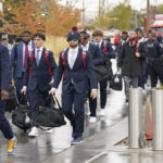 
              Arizona football players arrive at Rice-Eccles Stadium before their NCAA college football game against Utah Saturday, Nov. 5, 2022, in Salt Lake City. Arizona athletics, which has a $101.6 million budget and 21 sports, projects costs could increase by $4 million, according to Derek van der Merwe, an assistant vice president and chief operating officer for administration and athletics at the Pac-12 school. (AP Photo/Rick Bowmer)
            