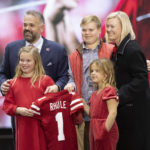 New Nebraska NCAA college football coach Matt Rhule, from left, poses for photos with his family, including his children Vivienne, 9, Bryant, 18, Leona, 7, and his wife, Julie, during an introductory press conference, Monday, Nov. 28, 2022, in Lincoln, Neb. (AP Photo/Rebecca S. Gratz)