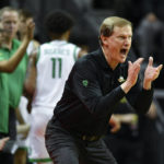 
              Oregon head coach Dana Altman encourages his team as they play Florida A&M during the first half of an NCAA college basketball game Monday, Nov. 7, 2022, in Eugene, Ore. (AP Photo/Andy Nelson)
            
