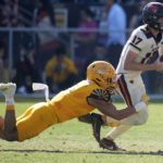 Oregon State quarterback Ben Gulbranson (17) gets sacked by Arizona State linebacker Merlin Robertson during the first half of an NCAA college football game in Tempe, Ariz., Saturday, Nov. 19, 2022. (AP Photo/Ross D. Franklin)