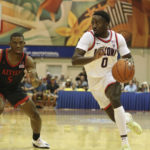 Arizona guard Courtney Ramey (0) gets around San Diego State guard Lamont Butler (5) during the first half of an NCAA college basketball game, Tuesday, Nov. 22, 2022, in Lahaina, Hawaii. (AP Photo/Marco Garcia)