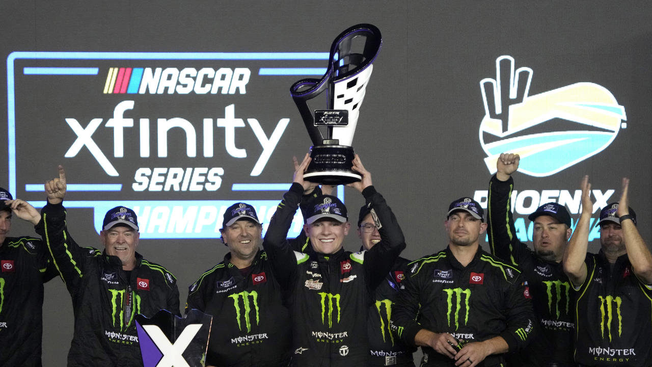 Ty Gibbs and team members celebrate after he won the NASCAR Xfinity Series auto race and the season...