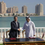 
              United States Secretary of State Antony Blinken, left, and Qatar Foreign Minister Mohammed Bin Adbulrahman Al Thani, shake hands after signing a letter of intent during a media event at the Diplomatic Club, in Tuesday, Nov. 22, 2022. America's top diplomat criticized a decision by FIFA to threaten players at the World Cup with yellow cards if they wear armbands supporting inclusion and diversity. (AP Photo/Ashley Landis)
            