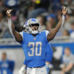 Detroit Lions running back Jamaal Williams (30) reacts after scoring on a 2-point conversion during the first half of an NFL football game against the Green Bay Packers, Sunday, Nov. 6, 2022, in Detroit. (AP Photo/Paul Sancya)
