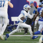 Detroit Lions safety Kerby Joseph (31) runs back an interception during the second half of an NFL football game against the New York Giants, Sunday, Nov. 20, 2022, in East Rutherford, N.J. (AP Photo/Seth Wenig)