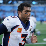 
              Denver Broncos quarterback Russell Wilson leaves the field after their loss during an NFL football game between the Carolina Panthers and the Denver Broncos on Sunday, Nov. 27, 2022, in Charlotte, N.C. (AP Photo/Jacob Kupferman)
            
