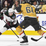 Arizona Coyotes left wing Matias Maccelli (63) is defended by Vegas Golden Knights right wing Mark Stone (61) during the third period of an NHL hockey game Thursday, Nov. 17, 2022, in Las Vegas. The Golden Knights won 4-1. (AP Photo/Sam Morris)