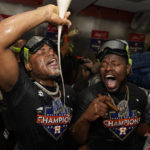 
              Houston Astros starting pitcher Framber Valdez, and Hector Neris celebrate in the locker room after their 4-1 World Series win against the Philadelphia Phillies in Game 6 on Saturday, Nov. 5, 2022, in Houston. (AP Photo/David J. Phillip)
            