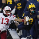 Michigan wide receiver Ronnie Bell (8) tries to make a catch as Nebraska defensive back Malcolm Hartzog (13) defends in the first half of an NCAA college football game in Ann Arbor, Mich., Saturday, Nov. 12, 2022. (AP Photo/Paul Sancya)