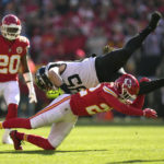 
              Jacksonville Jaguars tight end Dan Arnold is stopped by Kansas City Chiefs safety Juan Thornhill (22) as Chiefs safety Justin Reid (20) watches during the first half of an NFL football game Sunday, Nov. 13, 2022, in Kansas City, Mo. (AP Photo/Charlie Riedel)
            