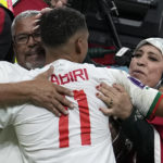 
              Morocco's Abdelhamid Sabiri celebrates with supporters after the World Cup group F soccer match between Belgium and Morocco, at the Al Thumama Stadium in Doha, Qatar, Sunday, Nov. 27, 2022. (AP Photo/Christophe Ena)
            
