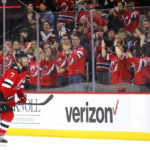 New Jersey Devils defenseman Dougie Hamilton (7) goes to the banch after scoring a goal against the Arizona Coyotes during the second period of an NHL hockey game, Saturday, Nov. 12, 2022, in Newark, N.J. (AP Photo/Noah K. Murray)