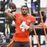 
              Cleveland Browns quarterback Deshaun Watson throws a pass during an NFL football practice at the team's training facility Wednesday, Nov. 30, 2022, in Berea, Ohio. (AP Photo/David Richard)
            