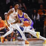 
              Tennessee Tech guard Jayvis Harvey (13) drives against Tennessee forward Julian Phillips (2) during the first half of an NCAA college basketball game Monday, Nov. 7, 2022, in Knoxville, Tenn. (AP Photo/Wade Payne)
            