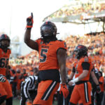 Oregon State running back Deshaun Fenwick (5) celebrates after scoring a touchdown against Oregon during the second half of an NCAA college football game on Saturday, Nov 26, 2022, in Corvallis, Ore. (AP Photo/Amanda Loman)