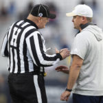 
              Georgia Tech interim head coach Brent Key speaks with a game official in the first half of an NCAA college football game against Miami, Saturday, Nov. 12, 2022, in Atlanta. (AP Photo/Hakim Wright Sr.)
            