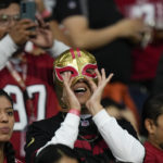 San Francisco 49ers fans look on before an NFL football game against the Arizona Cardinals, Monday, Nov. 21, 2022, in Mexico City. (AP Photo/Fernando Llano)