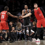 
              Brooklyn Nets forward Kevin Durant reacts after a call by referee Tyler Ford (39) as Portland Trail Blazers forward Justise Winslow (26) and center Jusuf Nurkic (27) slap hands during the first half of an NBA basketball game Sunday, Nov. 27, 2022, in New York. (AP Photo/Jessie Alcheh)
            