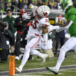 Utah wide receiver Jaylen Dixon (25) gets past Oregon defensive back Steve Stephens IV to score during the second half of an NCAA college football game Saturday, Nov. 19, 2022, in Eugene, Ore. (AP Photo/Andy Nelson)
