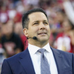 
              FILE -  Sports writer and television analyst Adam Schefter watches during an NFL football game between the San Francisco 49ers and the Los Angeles Rams in Santa Clara, Calif., Monday, Oct. 3, 2022.  So if Twitter is to be believed, LeBron James wants to leave the Lakers, Adam Schefter says Josh McDaniels is done as coach of the Raiders, and Connor McDavid has been traded from the Edmonton Oilers to the New York Islanders.  Each of the tweets seen Wednesday, Nov. 9, 2022, about the above items normally would count as major news in the world of sports, but none was real. Instead, all came from fake accounts.  (AP Photo/Godofredo A. Vásquez, File)
            