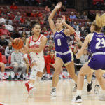 
              Ohio State's Madison Greene, left, passes the ball past North Alabama's Cameron Jones, center, and Alyssa Clutter during the second half of an NCAA college basketball game on Sunday, Nov. 27, 2022, in Columbus, Ohio. (AP Photo/Jay LaPrete)
            