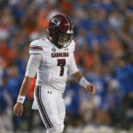 South Carolina quarterback Spencer Rattler (7) walks off the filed during the second half of an NCAA college football game against Florida, Saturday, Nov. 12, 2022, in Gainesville, Fla. (AP Photo/Matt Stamey)