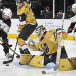 Vegas Golden Knights goaltender Logan Thompson (36) stops a shot by Arizona Coyotes left wing Nick Ritchie (12) during the third period of an NHL hockey game Thursday, Nov. 17, 2022, in Las Vegas. The Golden Knights won 4-1. (AP Photo/Sam Morris)