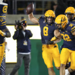 California linebacker Jackson Sirmon (8) celebrates with teammates after scoring a touchdown on a recovery of a Stanford fumble during the second half of an NCAA college football game in Berkeley, Calif., Saturday, Nov. 19, 2022. (AP Photo/Godofredo A. Vásquez)