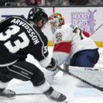 Los Angeles Kings left wing Viktor Arvidsson, left, scores on Florida Panthers goaltender Sergei Bobrovsky during the second period of an NHL hockey game Saturday, Nov. 5, 2022, in Los Angeles. (AP Photo/Mark J. Terrill)