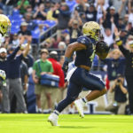 Navy fullback Daba Fofana runs the ball for a touchdown during the first half of an NCAA college football game against Notre Dame, Saturday, Nov. 12, 2022, in Baltimore. (AP Photo/Terrance Williams)
