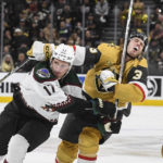 Vegas Golden Knights defenseman Brayden McNabb (3) is hit on the face by the stick of Arizona Coyotes center Nick Bjugstad (17) during the third period of an NHL hockey game Thursday, Nov. 17, 2022, in Las Vegas. The Golden Knights won 4-1. (AP Photo/Sam Morris)