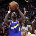 
              Golden State Warriors forward JaMychal Green (1) looks to shoot in front of Houston Rockets forward Usman Garuba (16) during the first half of an NBA basketball game Sunday, Nov. 20, 2022, in Houston. (AP Photo/Michael Wyke)
            