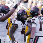 Oregon State running back Damien Martinez (6) celebrates his touchdown against Arizona State with Oregon State quarterback Ben Gulbranson (17) and offensive lineman Joshua Gray (67) during the second half of an NCAA college football game in Tempe, Ariz., Saturday, Nov. 19, 2022. Oregon State won 31-7. (AP Photo/Ross D. Franklin)