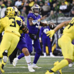 Washington quarterback Michael Penix Jr. (9) looks to pass against Oregon during the first half of an NCAA college football game Saturday, Nov. 12, 2022, in Eugene, Ore. (AP Photo/Andy Nelson)