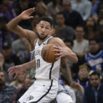 
              Brooklyn Nets guard Ben Simmons (10) makes a spin move in the key in the second half of an NBA basketball game against the Sacramento Kings in Sacramento, Calif., Tuesday, Nov. 15, 2022. The Kings won 153-121. (AP Photo/José Luis Villegas)
            