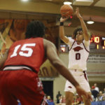 
              Arkansas guard Anthony Black (0) makes a shot over Louisville during the first half of an NCAA college basketball game, Monday, Nov. 21, 2022, in Lahaina, Hawaii. (AP Photo/Marco Garcia)
            
