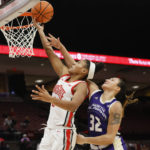 Ohio State's Taylor Thierry, left, shoots past North Alabama's Skyler Gill during the second half of an NCAA college basketball game on Sunday, Nov. 27, 2022, in Columbus, Ohio. (AP Photo/Jay LaPrete)