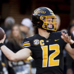 
              Missouri quarterback Brady Cook warms up before the start of an NCAA college football game against the Arkansas Friday, Nov. 25, 2022, in Columbia, Mo. (AP Photo/L.G. Patterson)
            