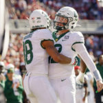 Baylor wide receiver Jordan Nabors, left, and quarterback Blake Shapen celebrate a touchdown by Nabors against Oklahoma in the first half of an NCAA college football game, Saturday, Nov. 5, 2022, in Norman, Okla. (AP Photo/Nate Billings)