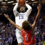 
              Kansas State guard Desi Sills (13) shoots over Texas-Rio Grande Valley guard Adante' Holiman (5) during the first half of an NCAA college basketball game Monday, Nov. 7, 2022, in Manhattan, Kan. (AP Photo/Charlie Riedel)
            