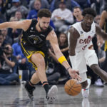 
              Golden State Warriors guard Klay Thompson (11) reaches for the ball next to Cleveland Cavaliers guard Caris LeVert (3) during the first half of an NBA basketball game in San Francisco, Friday, Nov. 11, 2022. (AP Photo/Jeff Chiu)
            