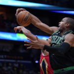 Boston Celtics center Al Horford (42) pulls down a rebound against New Orleans Pelicans guard CJ McCollum in the first half of an NBA basketball game in New Orleans, Friday, Nov. 18, 2022. (AP Photo/Gerald Herbert)