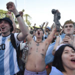 Argentina's soccer fans react at the end of their team's match against Mexico at the World Cup, hosted by Qatar, in Buenos Aires, Argentina, Saturday, Nov. 26, 2022. (AP Photo/Gustavo Garello)